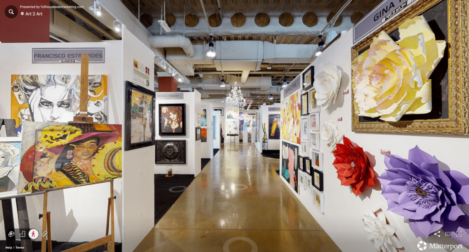 Wide interior view of the ART 2 art District in Las Vegas with colorful artworks throughout.